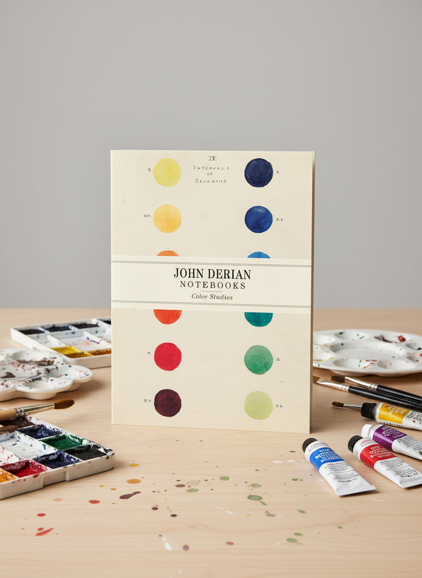John Derian notebooks with color study design on a beige background