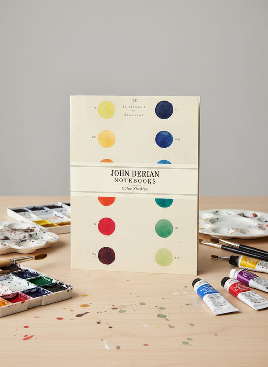 John Derian notebooks with color study design on a beige background