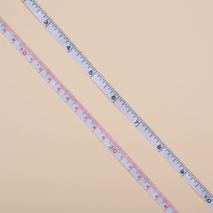 Measuring tape on a concrete surface