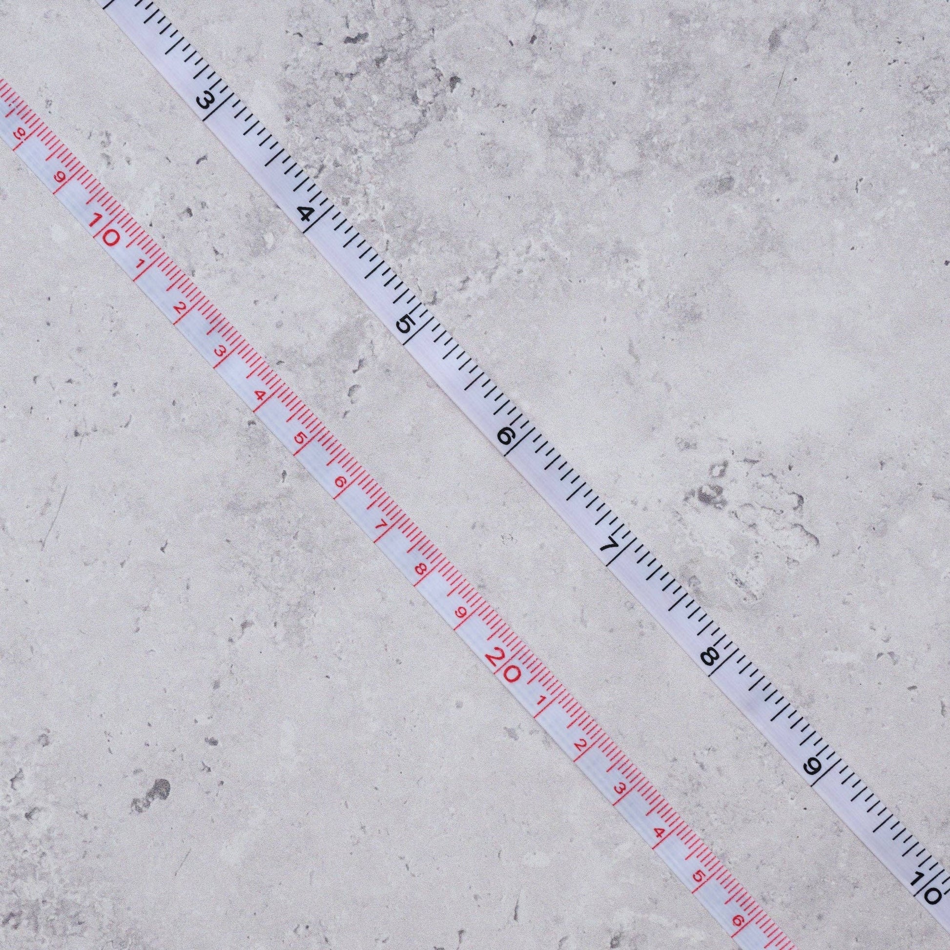 Measuring tape on a concrete surface