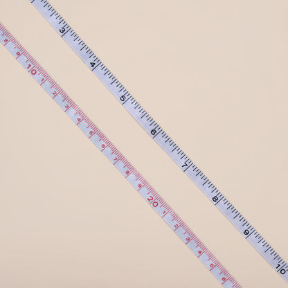 Measuring tape on a concrete surface