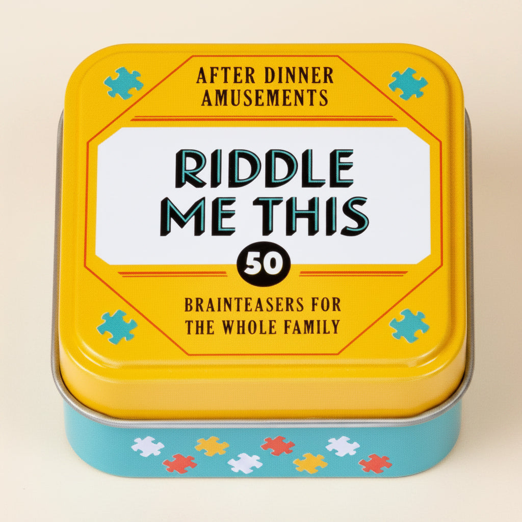 Yellow tin box with 'Riddle Me This' riddle book for family entertainment on a white background