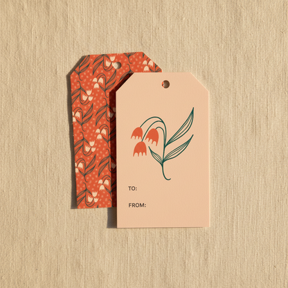 The Dosado Red gift tags featuring hand-drawn red flowers on a beige textured background