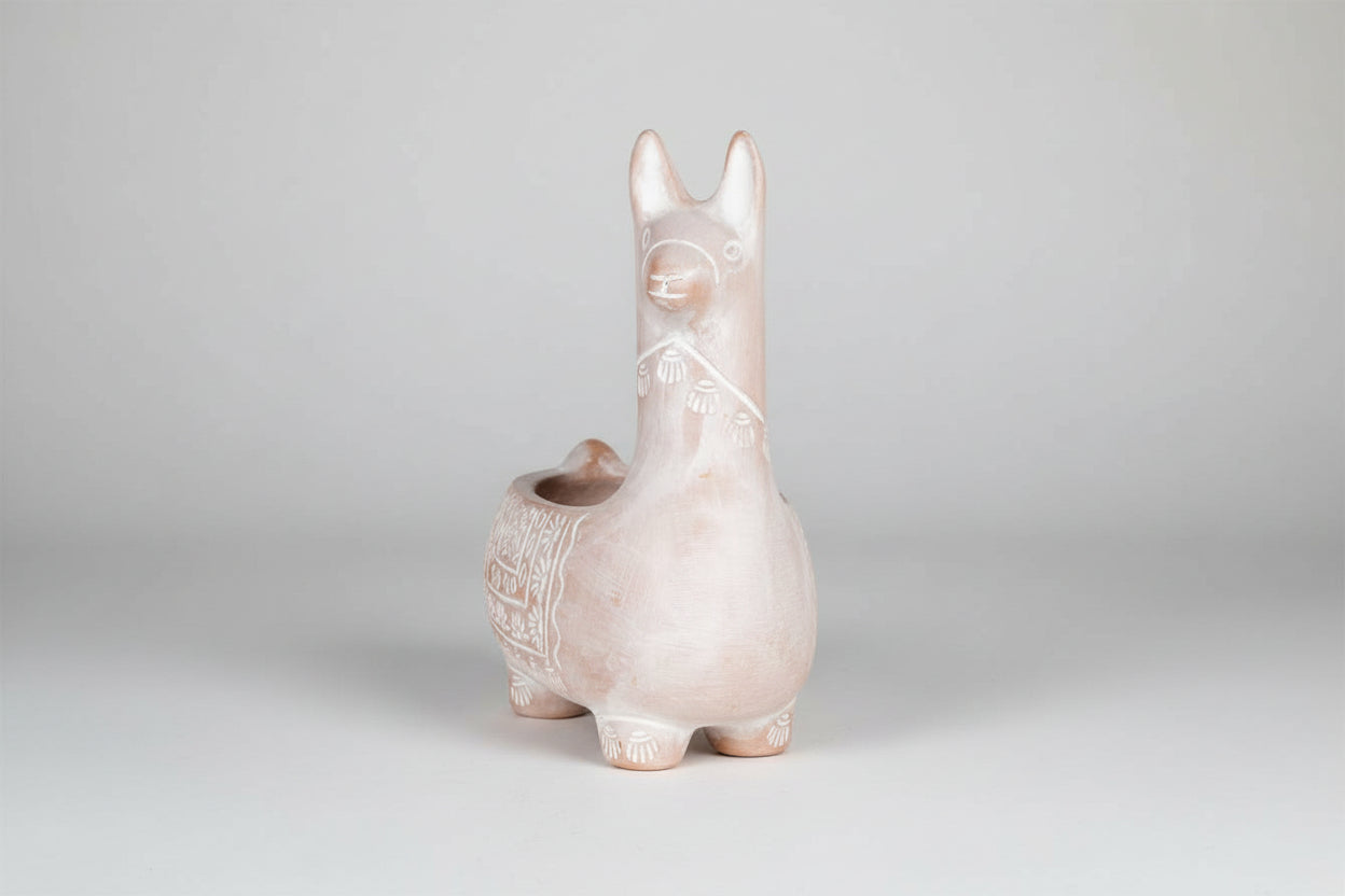 Ceramic llama-shaped planter on a white background