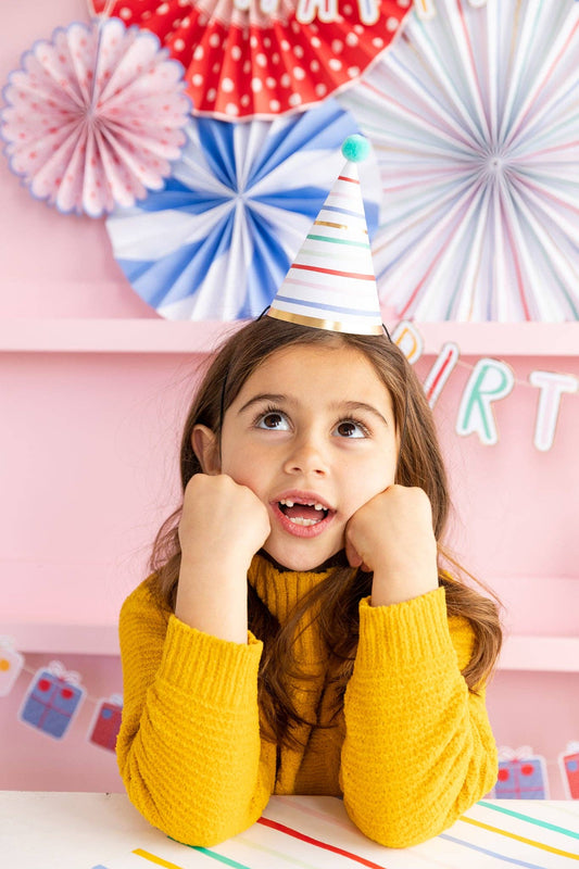 Image of child wearing the party hat with whimsical party wall decor