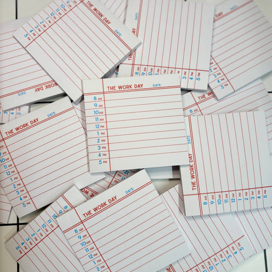 Neatly stacked The Work Day Post It Notes