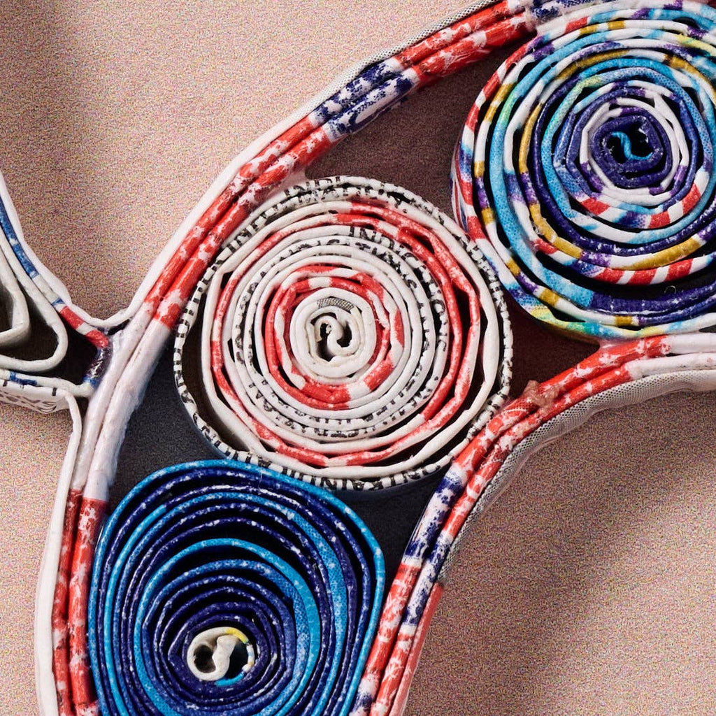 Colorful woven pattern on a wooden surface