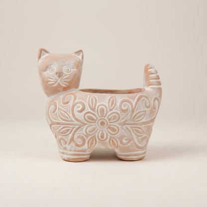 Cat-shaped ceramic planter with floral patterns on a white background