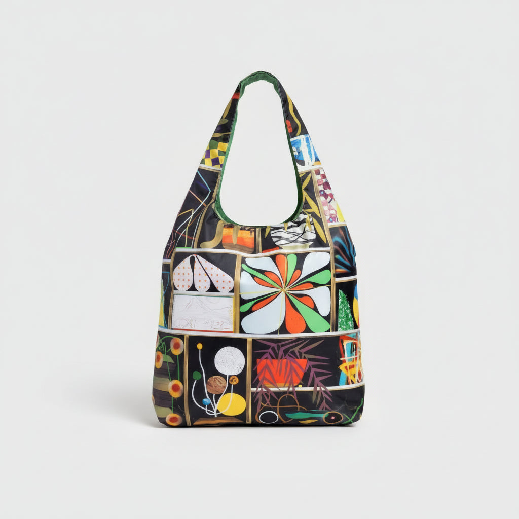 An eco-friendly tote bag designed by Paul Wackers, featuring bold, surreal artwork in an airbrush-meets-collage style.