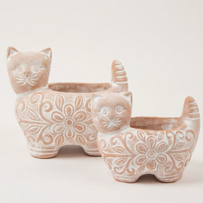 Ceramic cat-shaped planters with floral patterns on a white background