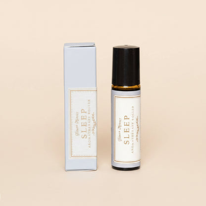 Sleep aromatherapy rollerball with packaging on a white background