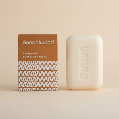 Sandalwood handcrafted plant-based soap bar with packaging on a white background