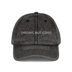 Black distressed cap with 'Chronic But Iconic' text on a white background