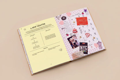 Open book with a calendar page and decorative elements on a pink background