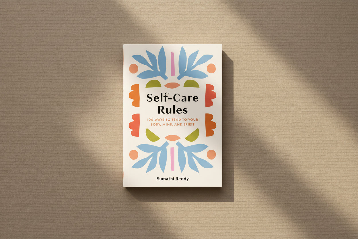 Book titled 'Self-Care Rules' with decorative cover on a beige background