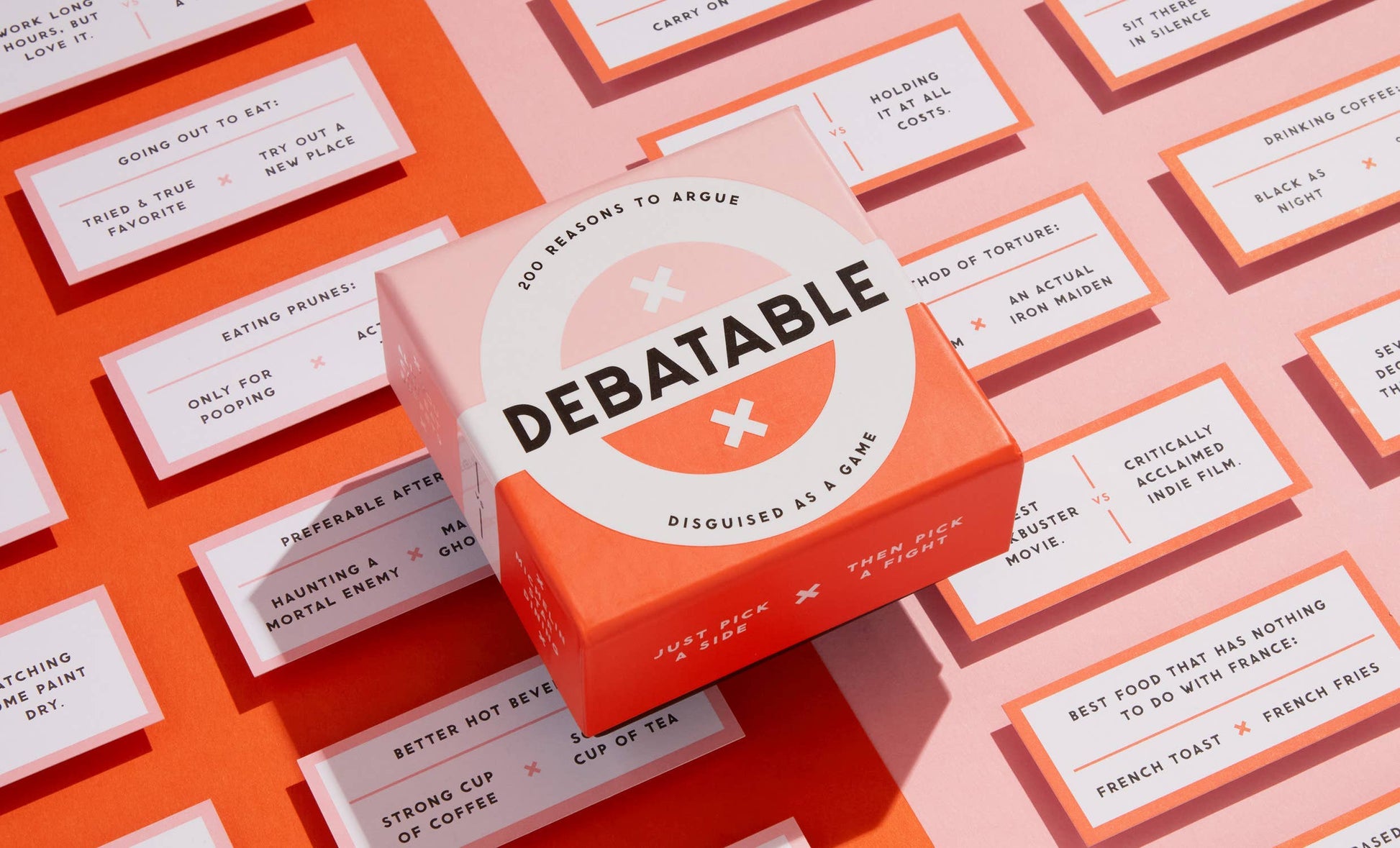 Close-up of two-sided debate cards with cheeky everyday arguments