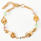 Handmade jewelry flat lay with springtime accessories and floral props