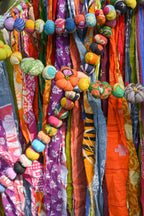Detail shot of individual pumpkins made from recycled sari fabric with visible stitching and texture