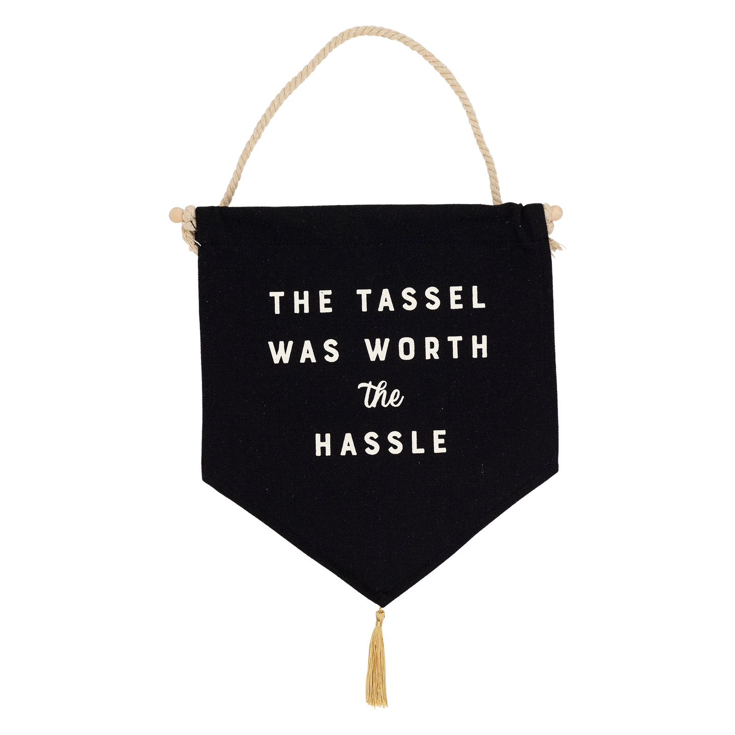 Close up of the Graduation canvas banner with "The Tassle Was Worth the Hassle" text, wood dowel, and gold tassel
