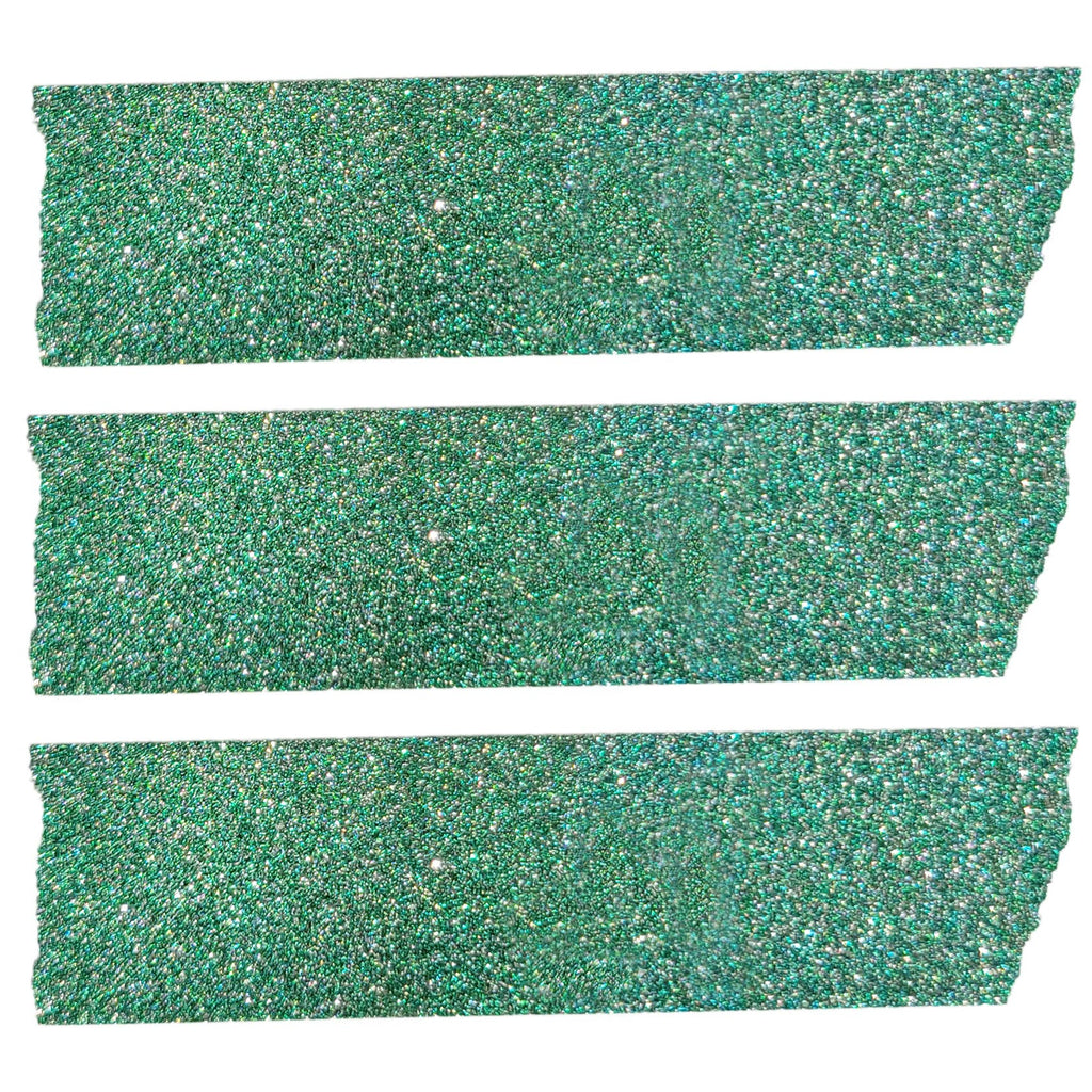 Close up view of three strips of the glittery green washi craft tape