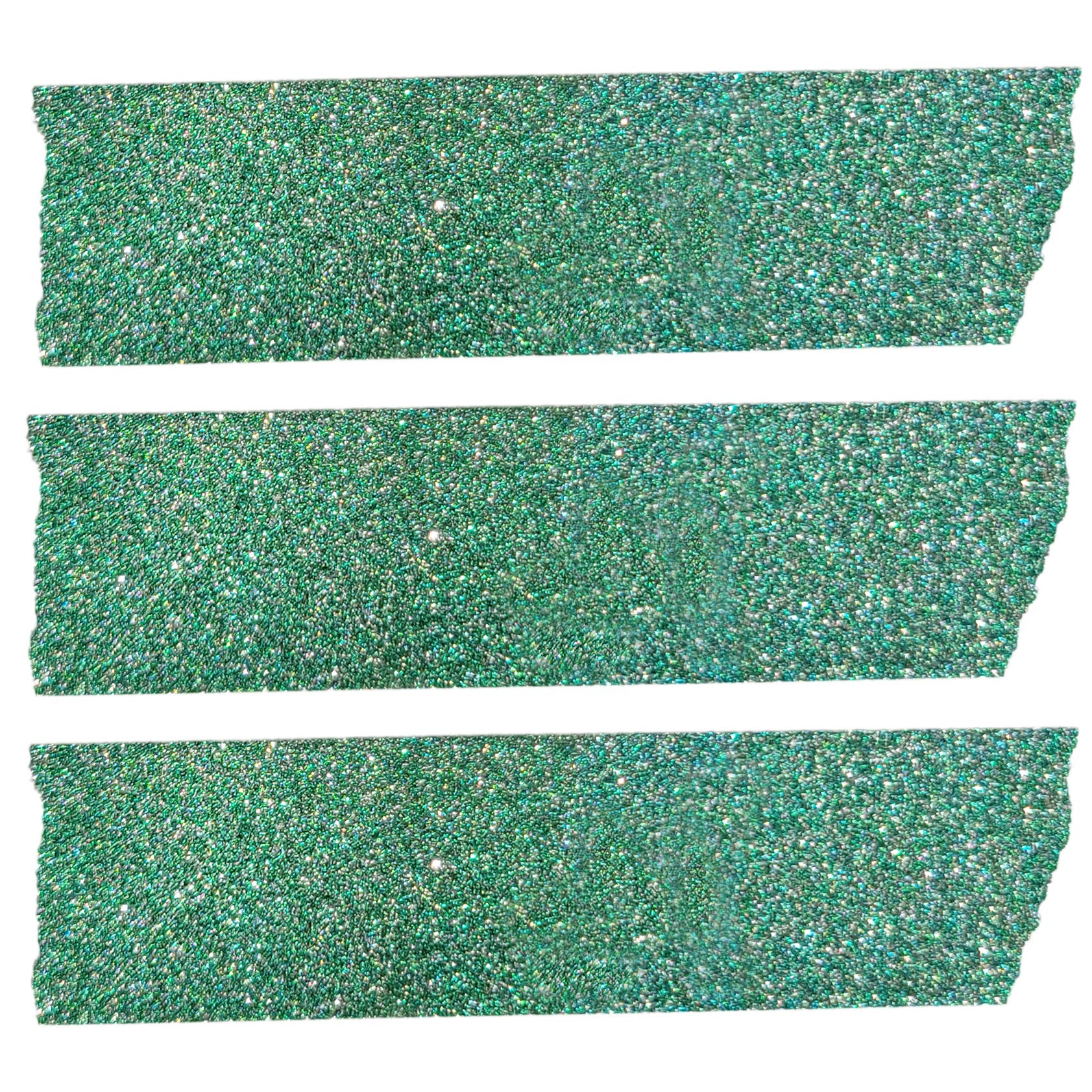 Close up view of three strips of the glittery green washi craft tape