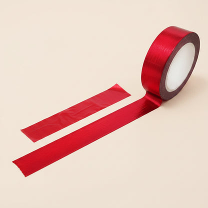 Image of shiny red washi tape with a light beige background