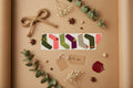 Colorful pattern of socks or stocking on brown craft paper and with other crafting elements in the background.