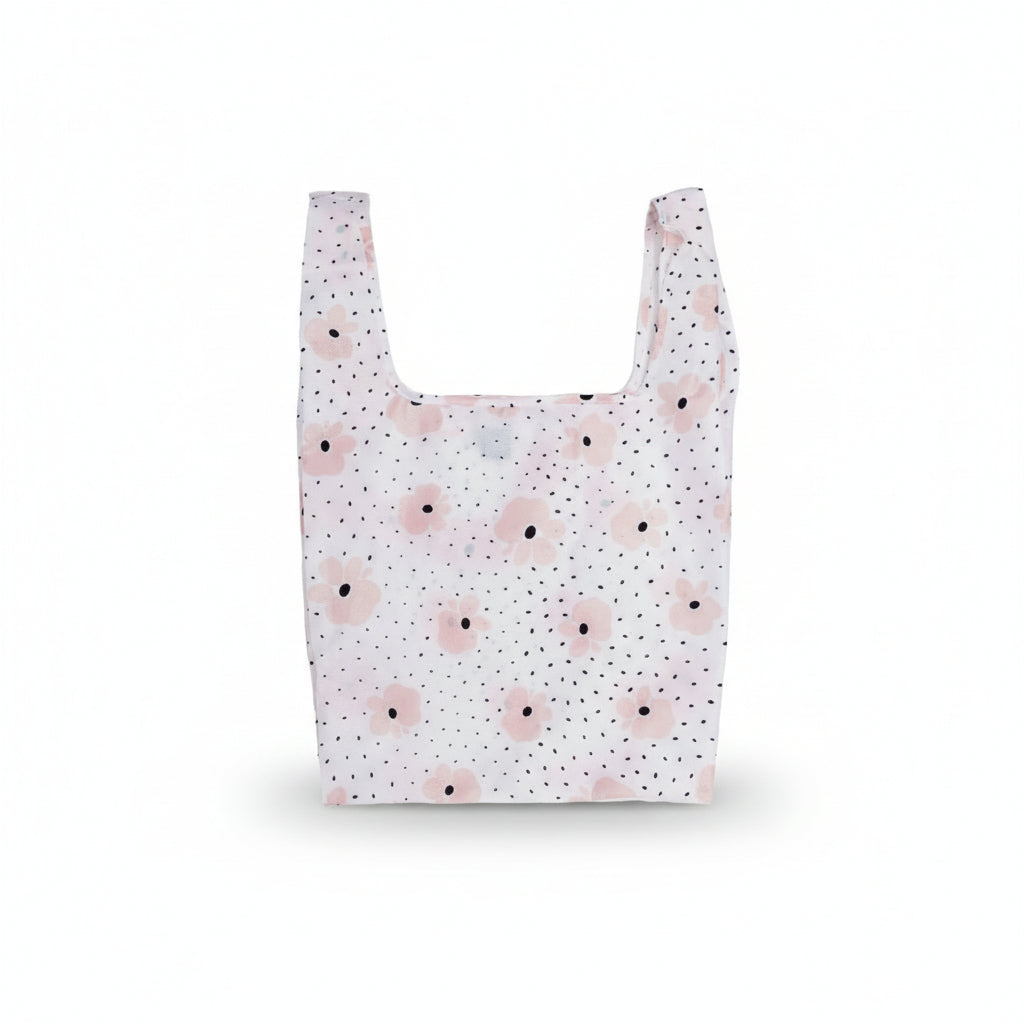 Carley Daily Shopper from BRNG bag with pink flowers and black polka dots unfolded and on a white background.
