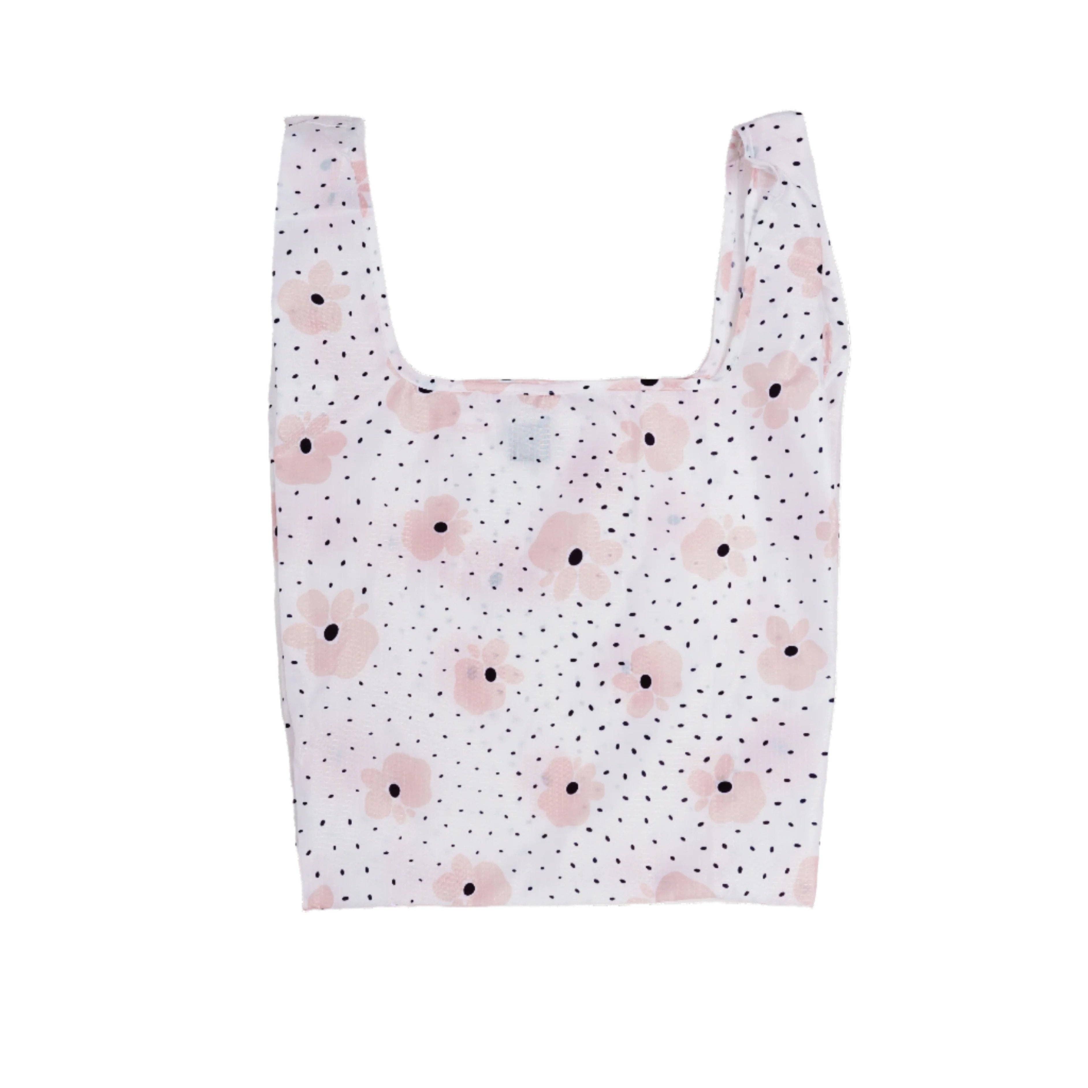 Carley Daily Shopper from BRNG bag with pink flowers and black polka dots unfolded and on a white background.