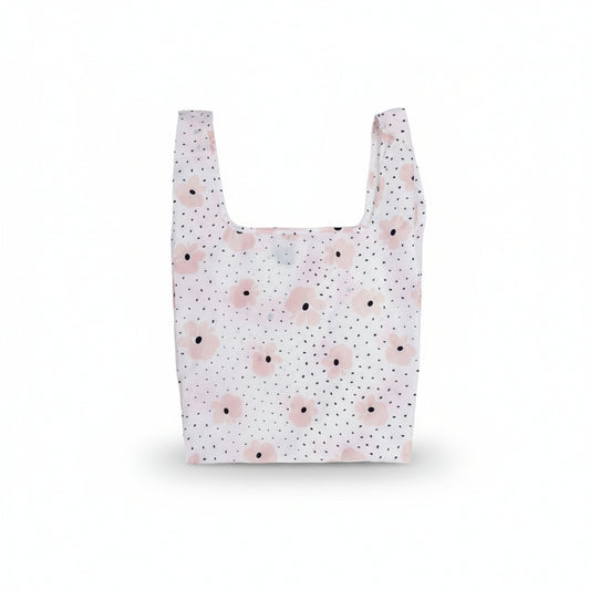 Carley Daily Shopper from BRNG bag with pink flowers and black polka dots unfolded and on a white background.