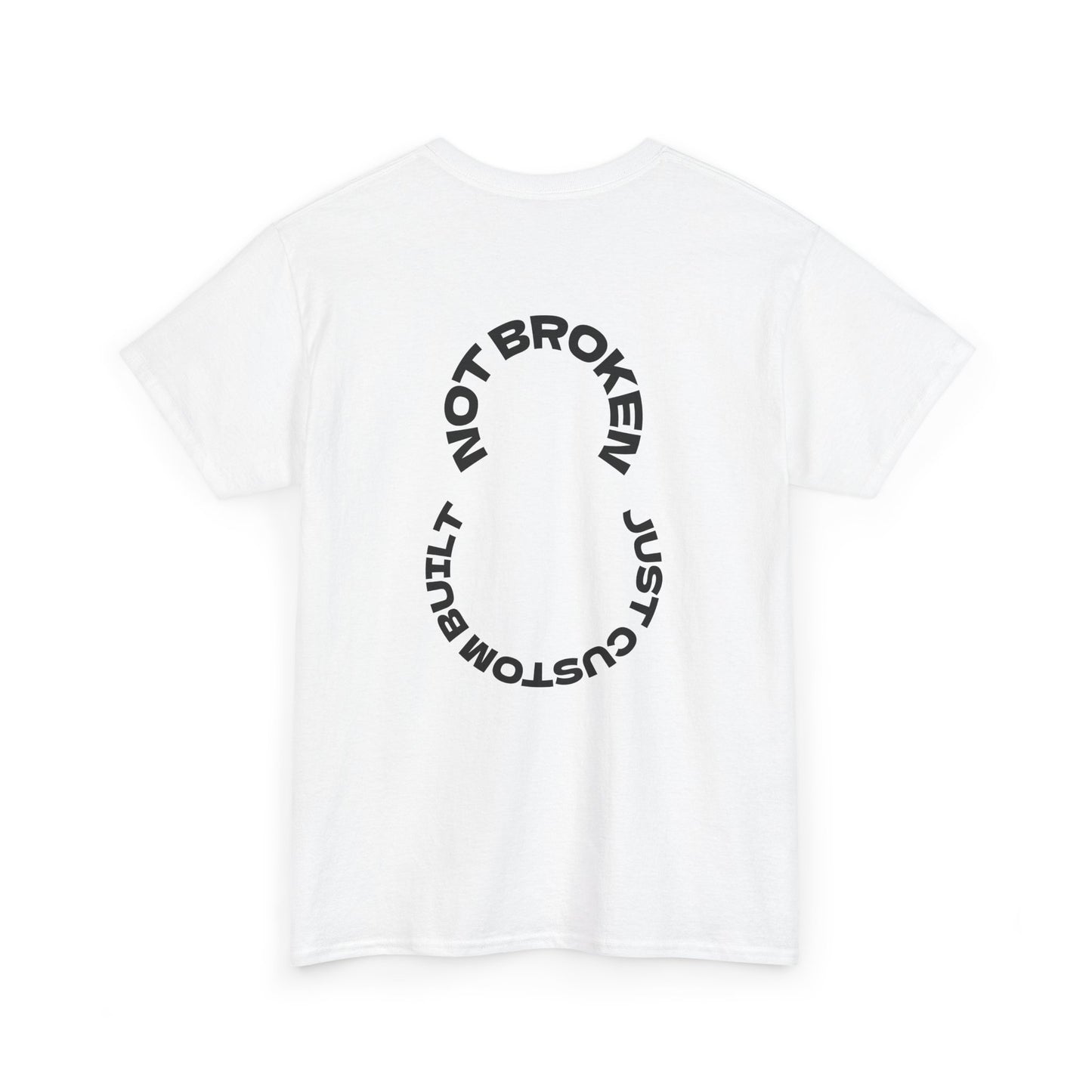 White t-shirt with black text "Not Broken, Just Custom Built" on a white background