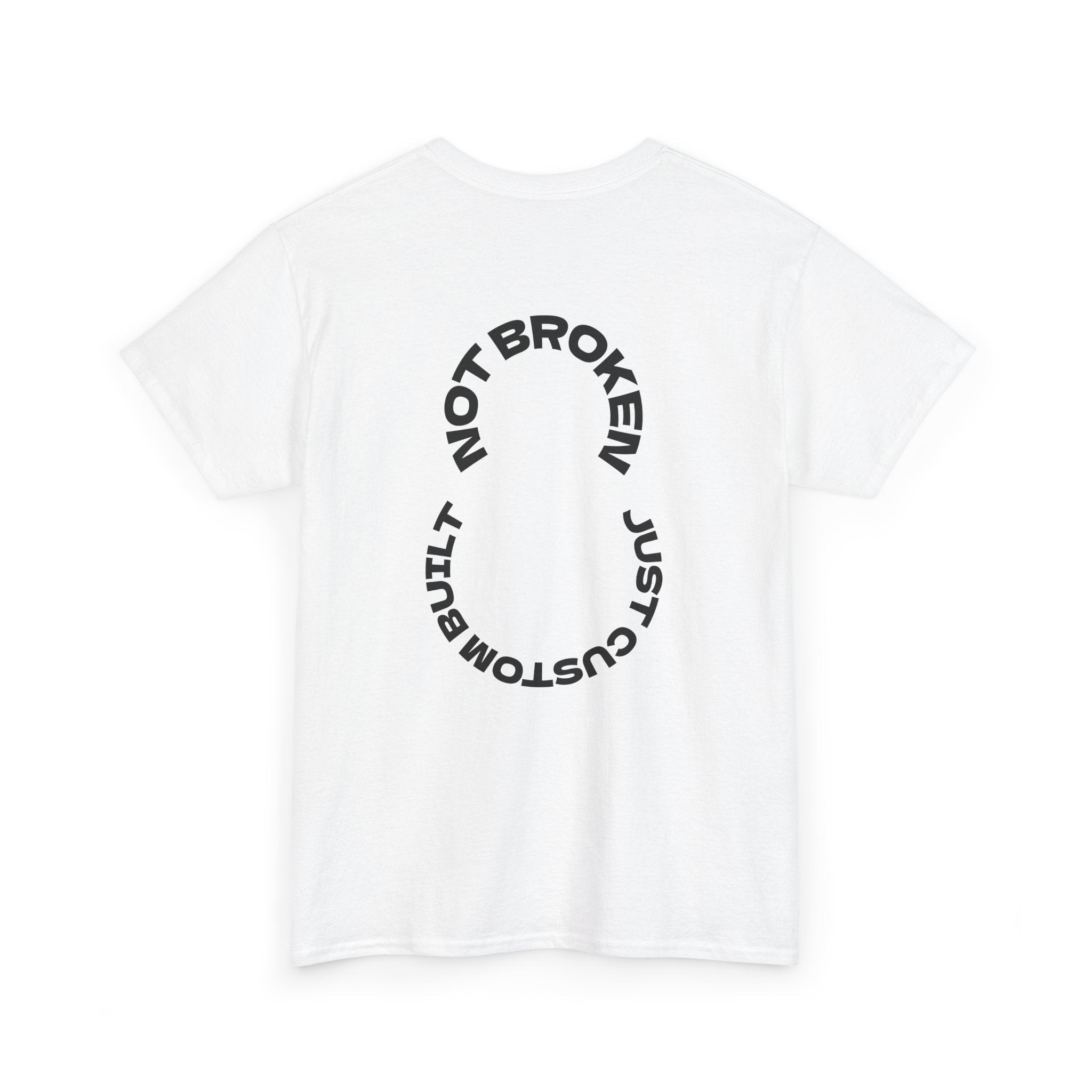 White t-shirt with black text "Not Broken, Just Custom Built" on a white background