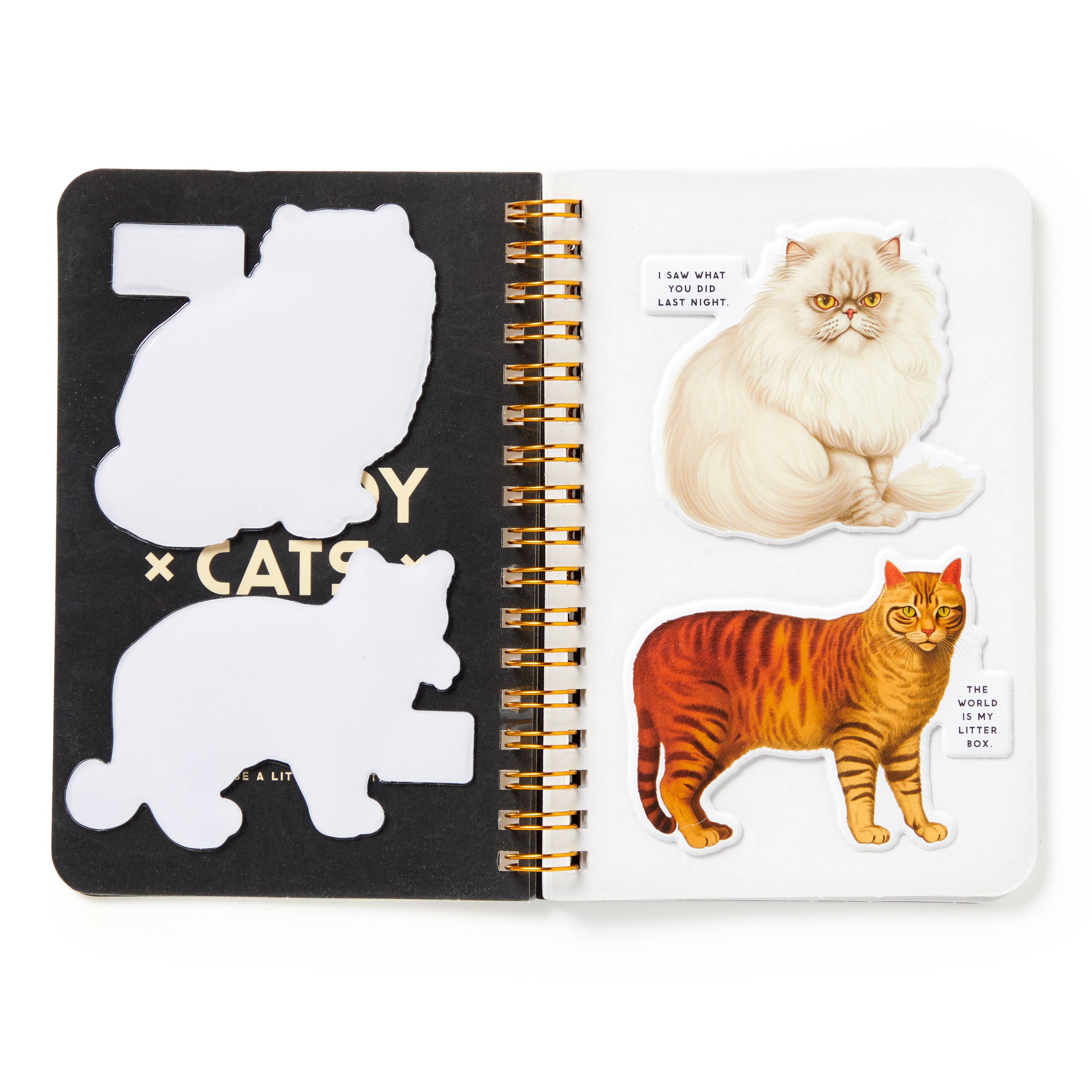 Open notebook with cat-themed stickers on a white background