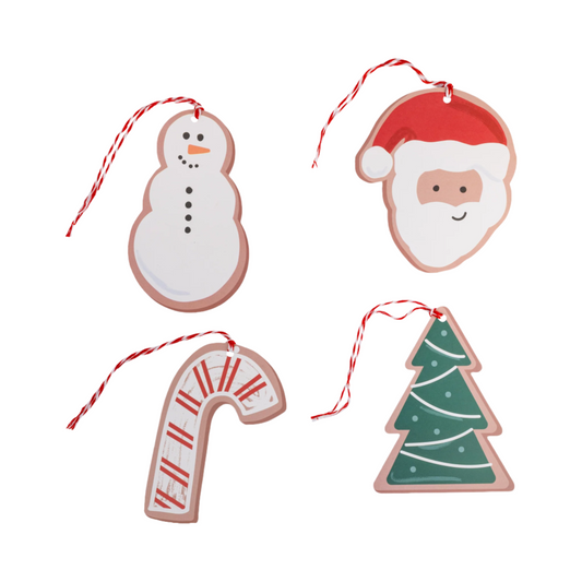 Set of Christmas-themed cookie cutout ornaments on a white background