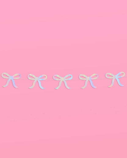 Glam pink bow garland with iridescent foil finish—4 strands, 12' each—perfect for adding sparkle to bridal showers, bachelorette parties, and baby showers.