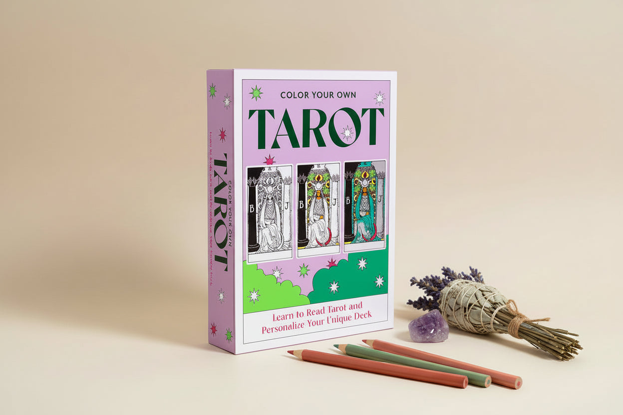 Color Your Own Tarot book with tarot cards and pencils on a beige background