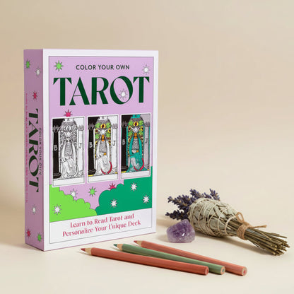 Color Your Own Tarot book with tarot cards and pencils on a beige background
