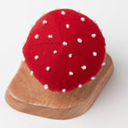 Overhead view of the red mushroom top with hand-stitched white spots for added details