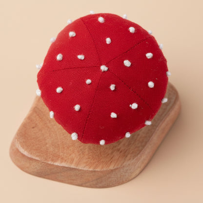 Overhead view of the red mushroom top with hand-stitched white spots for added details