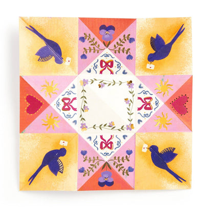 Colorful quilt pattern with birds, flowers, and geometric shapes on a white background