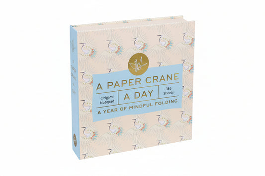 Origami notepad with crane design and text on a white background