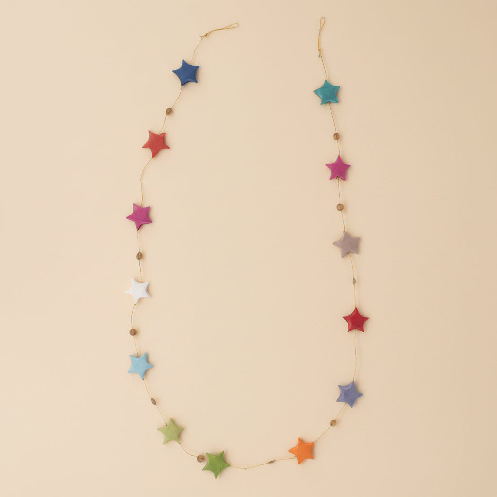 Close-up of rainbow paper stars with fine handmade texture