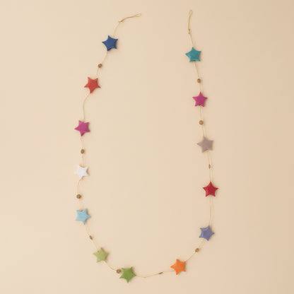 Close-up of rainbow paper stars with fine handmade texture