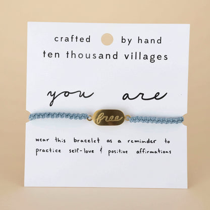 Bracelet with 'you are free' tag on a card from Ten Thousand Villages