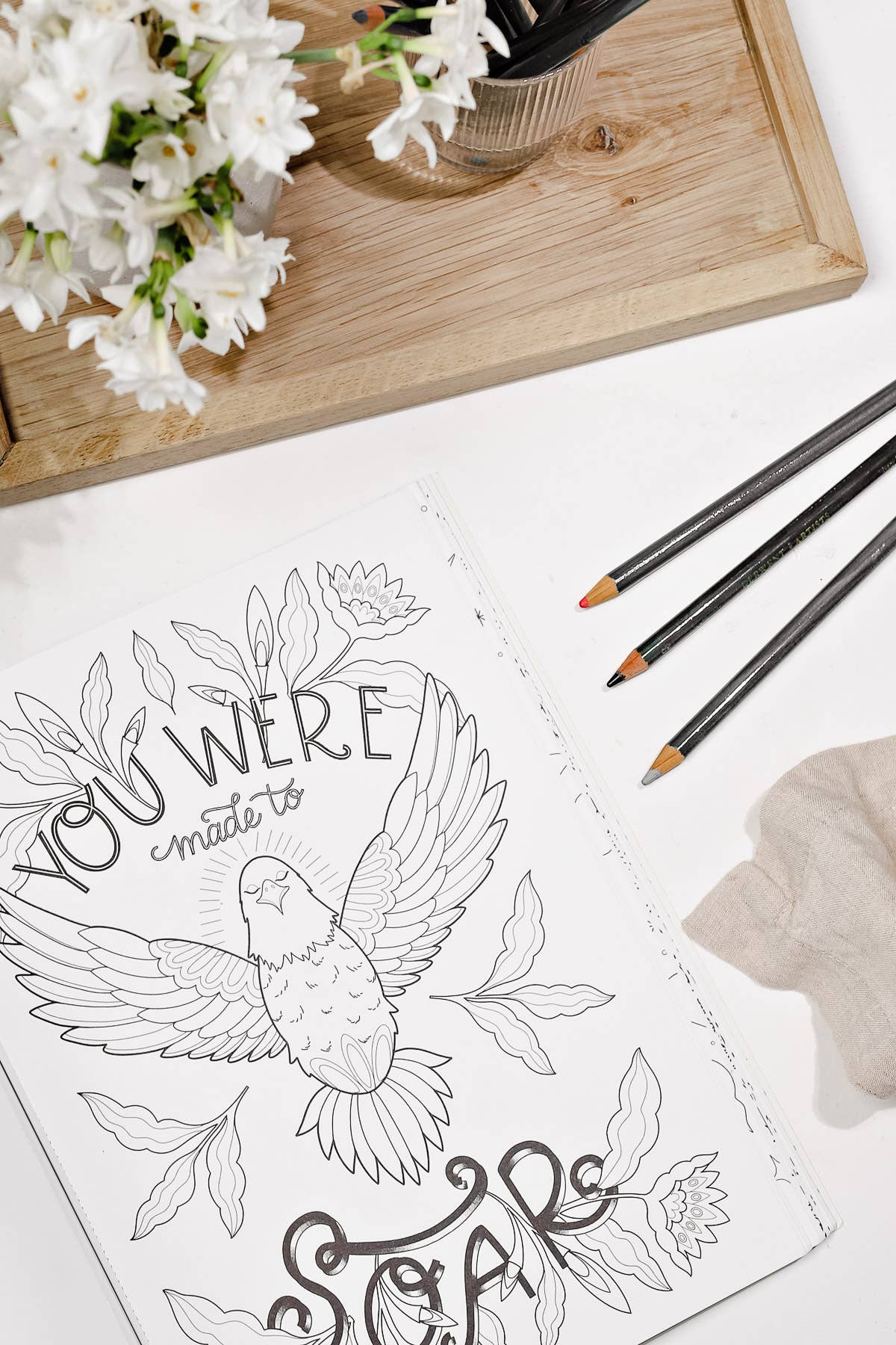 "You are made to Soar" prompt on the coloring book page with a bird.