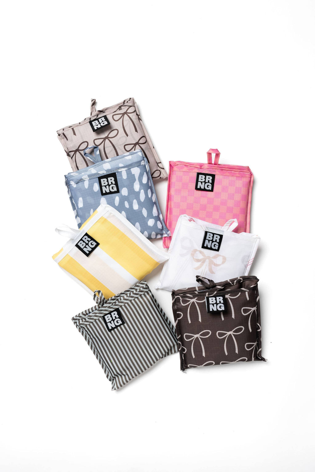 A Collection of BRNG Bags folded up on a white background.