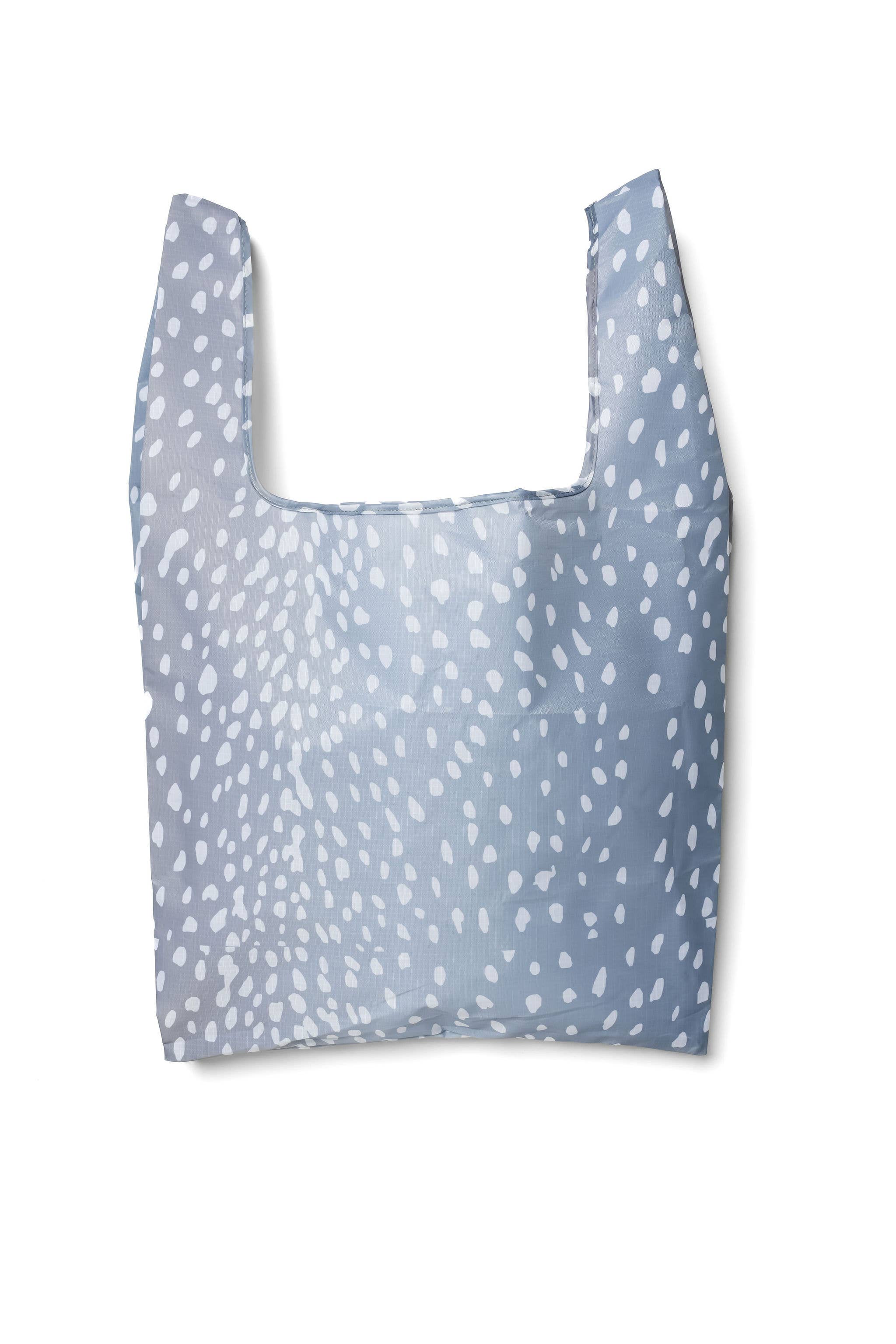 A blue tote shopping bag with a woodland-inspired fawn-print pattern.