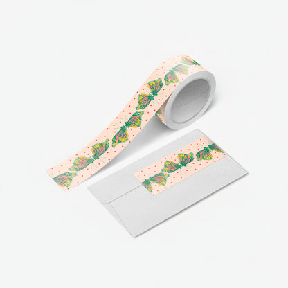 Close-up of monarch butterfly washi tape unspooled with vivid orange wings