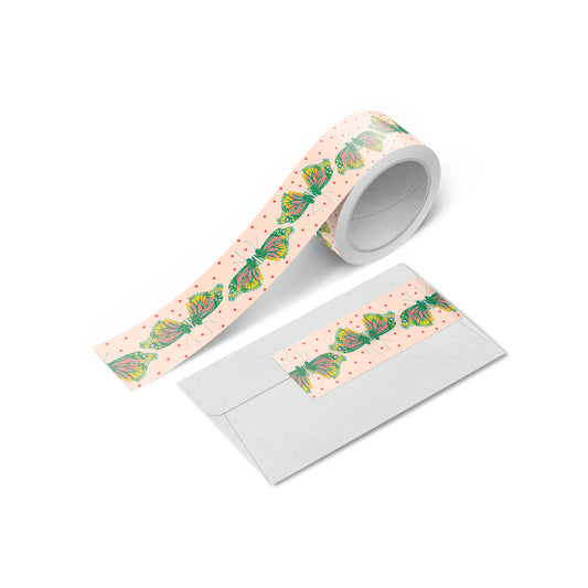 Close-up of monarch butterfly washi tape unspooled with vivid orange wings