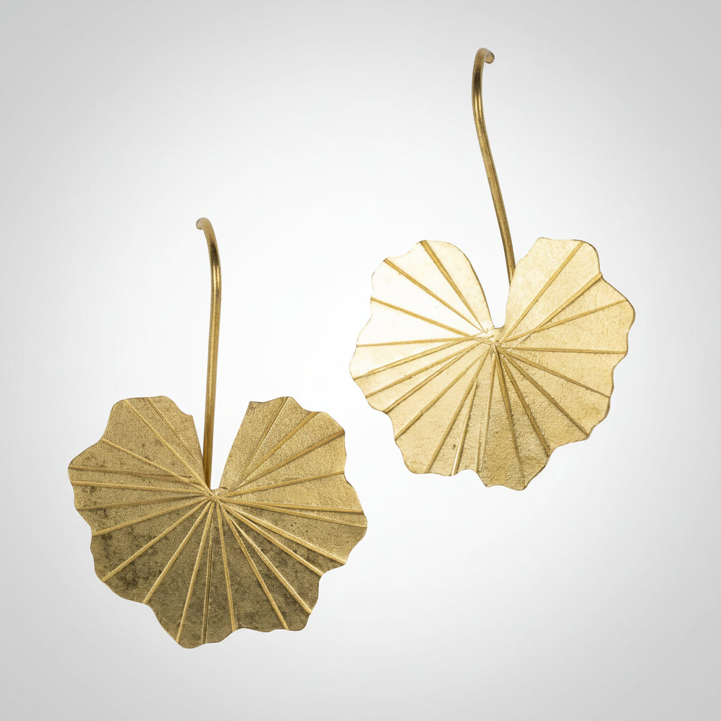 Pair of brass lotus leaf-shaped earrings on a white background